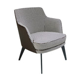 Kortárs stílusú, fekete színű műbőrrel és pepita színű szövettel kárpitozott dizájn fotel.