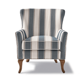 Kék és fehér csíkos szövettel kárpitozott, kézműves füles fotel.