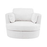 Fehér, szövetkárpitozású, forgó design fotel elölről, párnákkal.