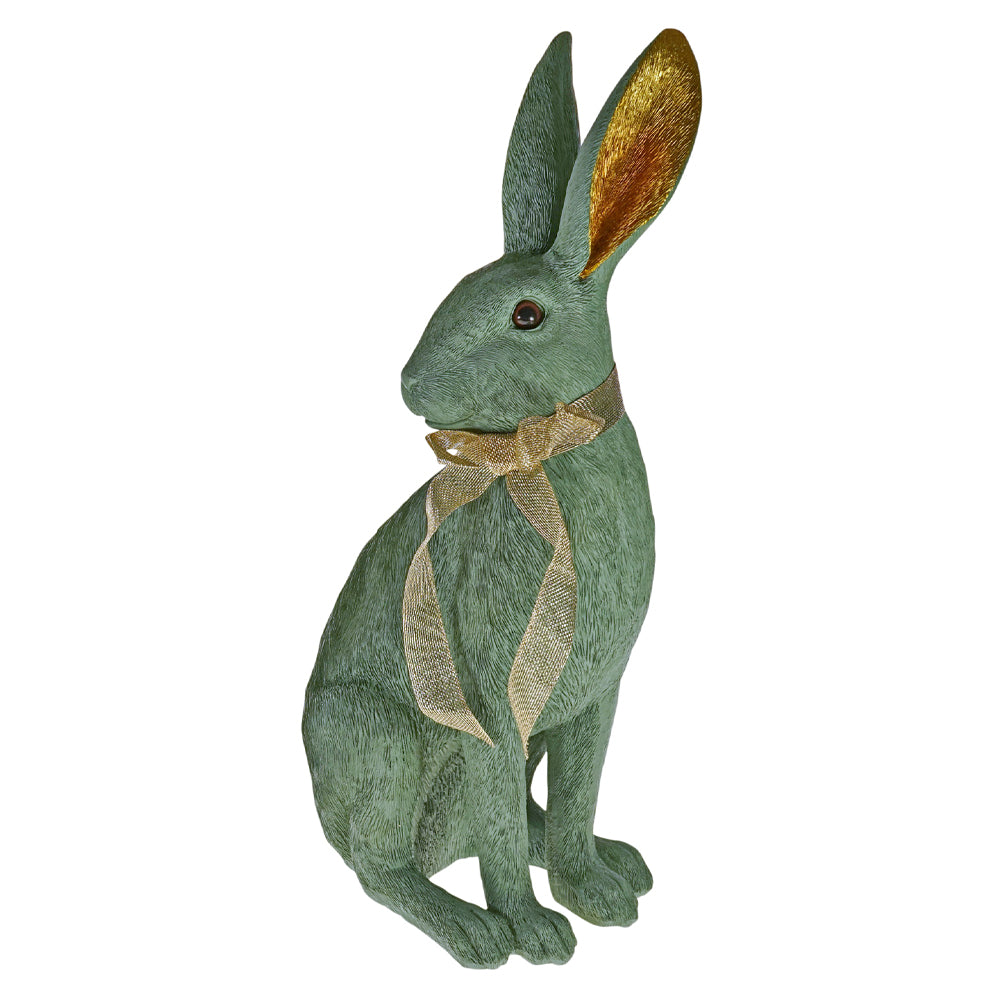 Türkizszínű, masnival díszített nyuszi figura.