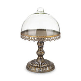 Óarany színű fémből készült, díszes kialakítású süteményes állvány üvegbúrával.