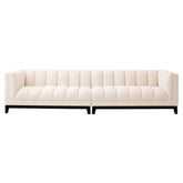 Krémszínű buklé szövettel kárpitozott, prémium minőségű, formatervezett design kanapé.