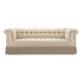 Krémszínű buklészövettel kárpitozott, 3 személyes kanapé.