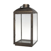 Rézszínű, fémből készült kézműves lámpás.