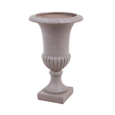 Taupe színű, klasszikus formavilágú, talpas nagy kaspó.