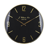 Fekete-arany színű falióra.