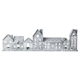 Szürke színű, bádogból készült házikókat formázó lámpás.