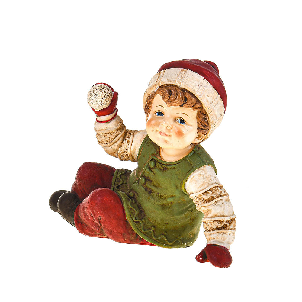 HERITAGE karácsonyi téli kisfiú figura hógolyóval, vintage stílusban, zöld mellénnyel és piros nadrággal.