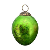 Függeszthető kialalkítású, zöld színű húsvéti üvegtojás.