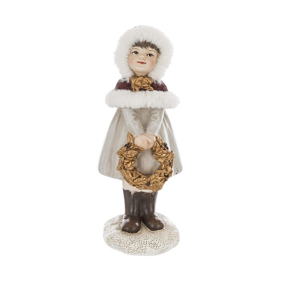 Krémszínű karácsonyi kislány figura.