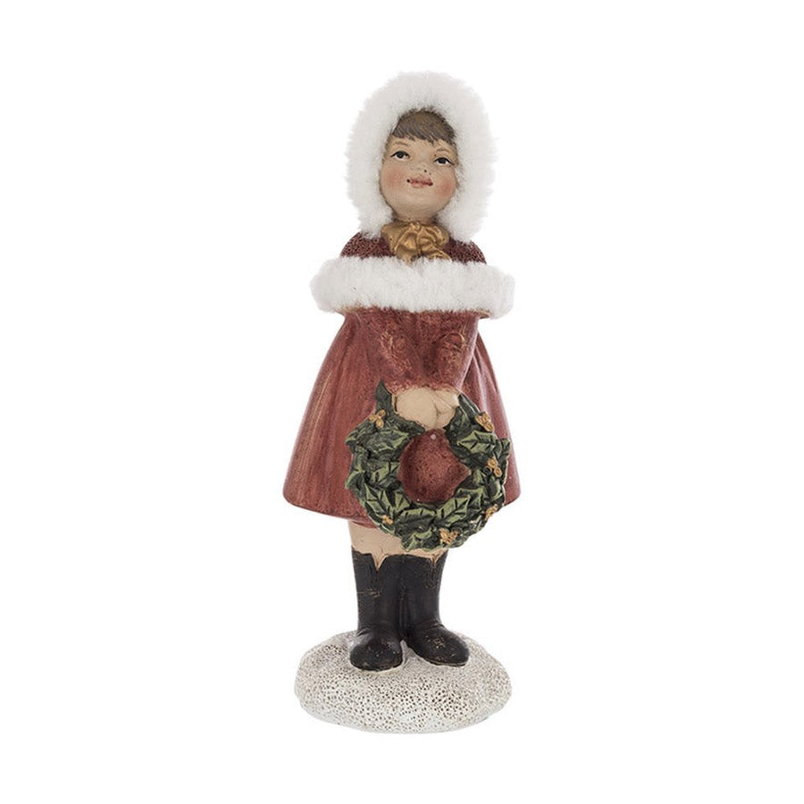 Piros színű karácsonyi kislány figura.