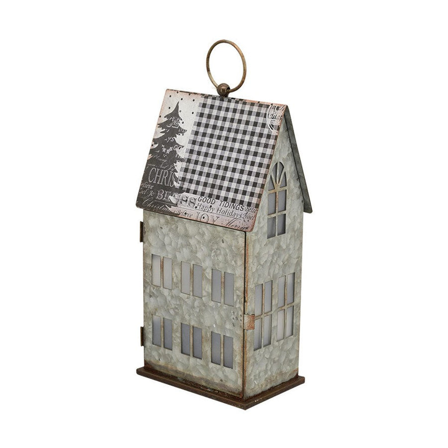 LED világítással rendelkező karácsonyi bádog házikó.