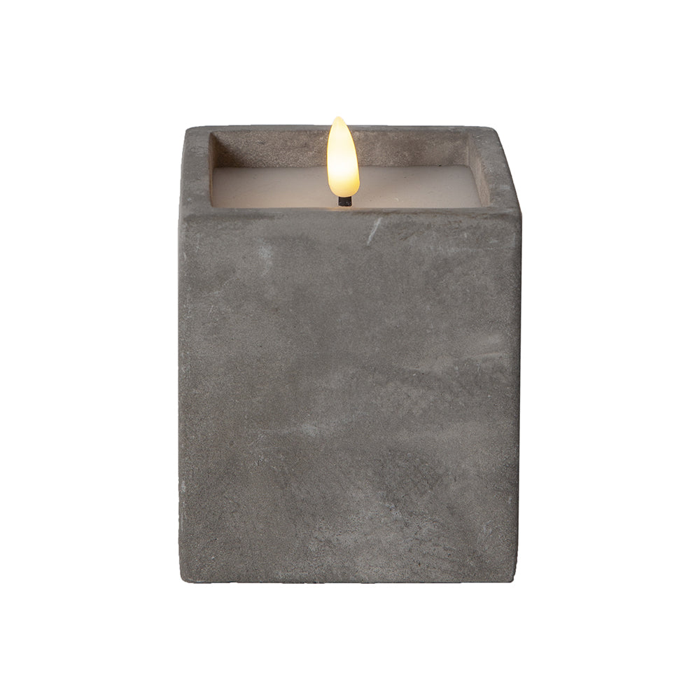 Szürke cement tégelyben kialakított LED gyertya.