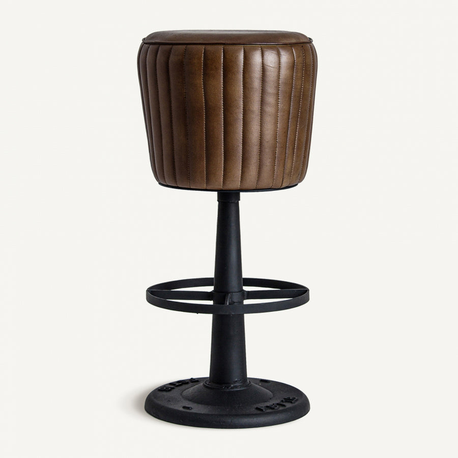 Full view of SENEY 79 cm bar stool with brown quilted leather seat black metal pedestal base and circular footrest