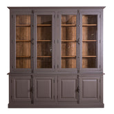 MAISON vitrines könyvszekrény sötétbarna színben, üveges felső résszel és díszes rúdzáras fogantyúkkal.