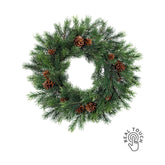 Sötétzöld színű, mű lucfenyő koszorú.