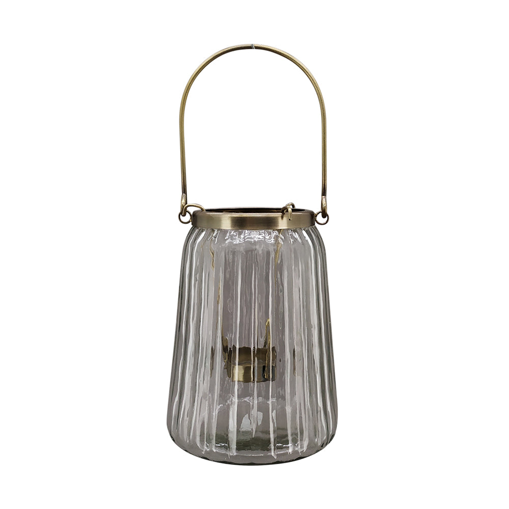 Bordázott üvegből és aranyszínű alumíniumból készült mécsestartó.