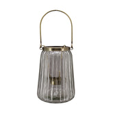 Bordázott üvegből és aranyszínű alumíniumból készült mécsestartó.