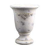 Krémszínű, antikolt felületű, magas cement kaspó növényi motívum díszítéssel, a VALO kollekcióból.