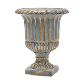 Rusztikus, antikolt felületű, kannelúrás díszítésű, arany-szürke színű cement kaspó.