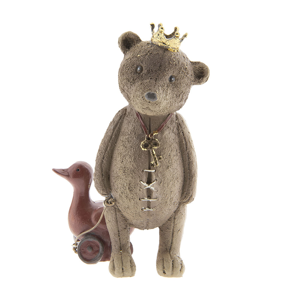 Játék libát húzó, koronát viselő nosztalgikus maci figura. Játék libát húzó, koronát viselő nosztalgikus maci figura.