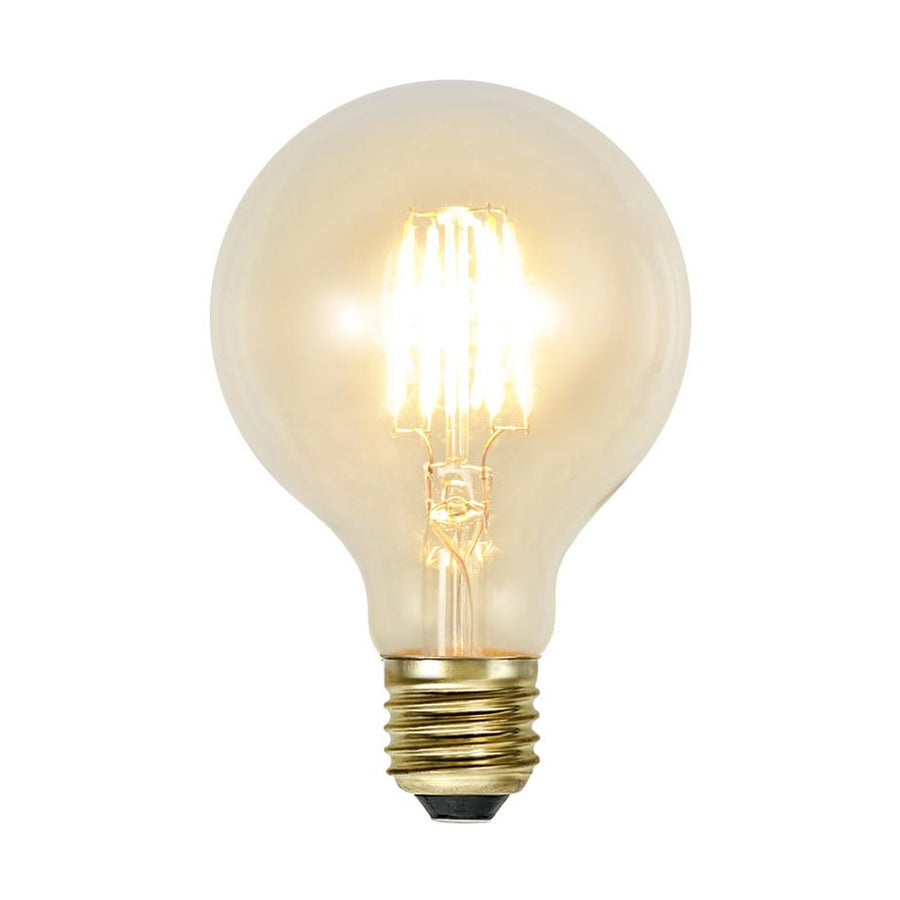 Clear Filament dekorációs izzó. Meleg fehér fényű LED dekorációs izzó áttetsző üveggel.