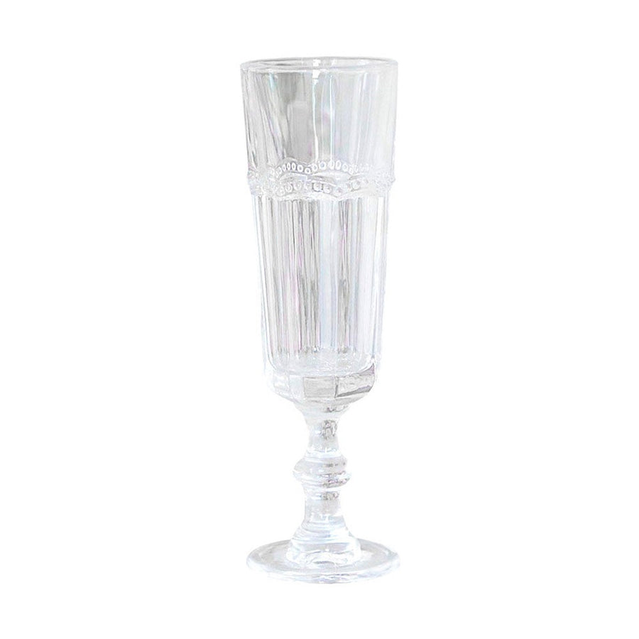 Vintage stílusú, pontozott dombormintával díszített átlátszó üvegű pezsgőspohár.