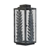 Fémleveles ággal díszített, vintage stílusú, patinás felületű fémből készült lámpás.