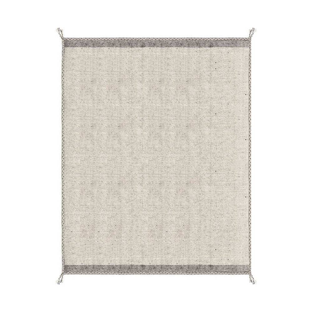 Bézs színű gyapjú szőnyeg.