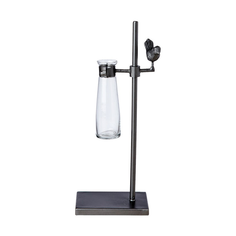 Loft stílusú,, madárkával díszített, fém lombikállványba helyezett üveg váza.