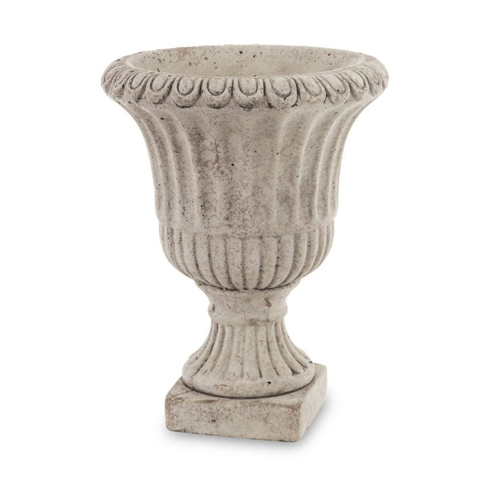 Antikolt felületű, szürke színű talpas cement kaspó.