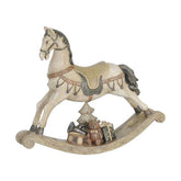 Antikolt felületű, krémszínű karácsonyi hintaló.