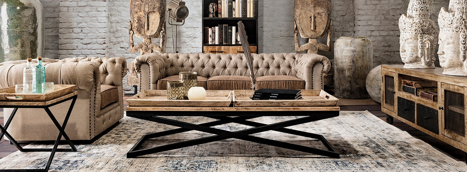 Kortárs dohányzóasztal Chesterfield kanapéval.