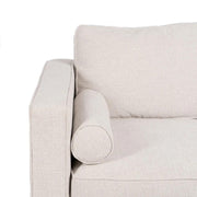 Bézs színű szövettel kárpitozott, 2 személyes kanapé.