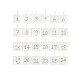 Antik fehér színű paraffinból készült, aranyszínű számokkal díszített, kocka formájú, 24 db-os adventi gyertya szett.