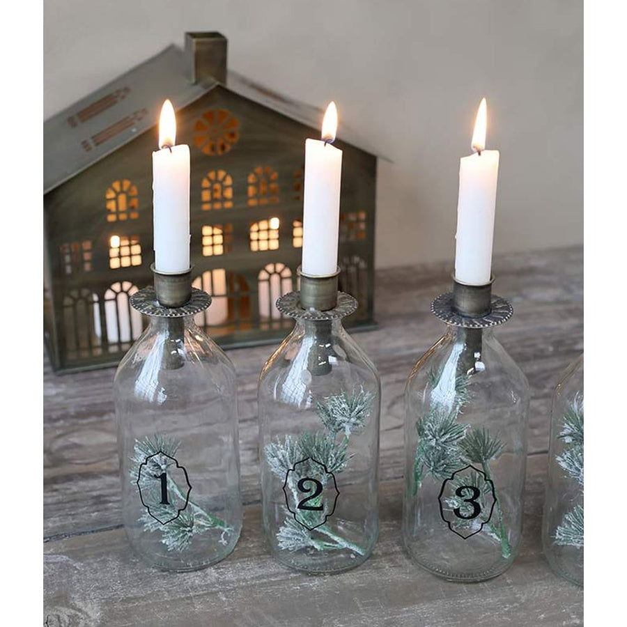 4 darabos, számozott díszítésű üvegpalackba kialakított adventi gyertyatartó szett.