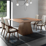 Kortárs stílusú, diófa furnérral borított, formatervezett, étkezőasztal üvegbetéttel.