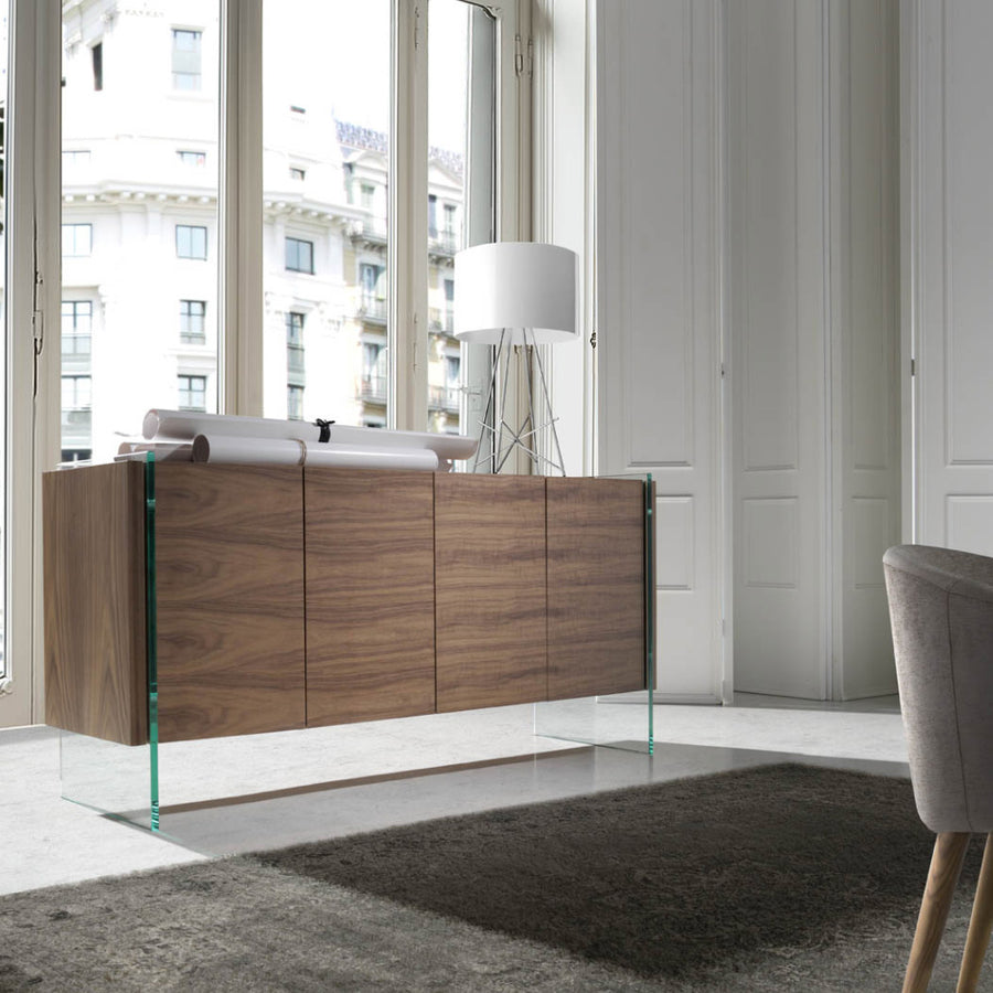 Kortárs, diófa furnérral borított, dizájn komódszekrény edzett üveg lábakkal.