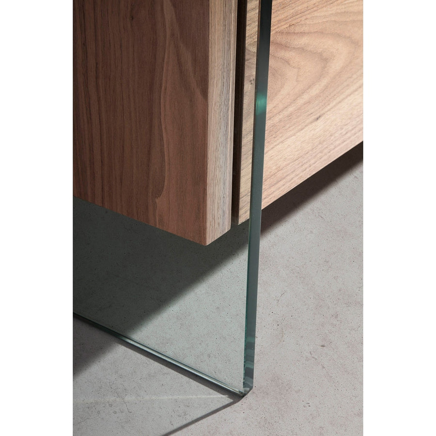 Kortárs, diófa furnérral borított, dizájn komódszekrény edzett üveg lábakkal.