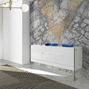 Kortárs stílusú,magasfényű, fehér lakkal festett, dizájn komódszekrény edzett üveg lábakkal.