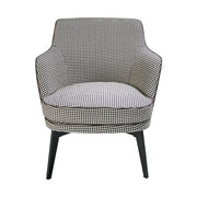 Kortárs stílusú, fekete színű műbőrrel és pepita színű szövettel kárpitozott dizájn fotel.