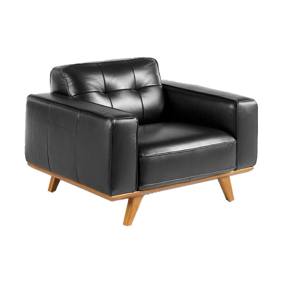 Kortárs stílusú, fekete bőrrel kárpitozott, dizájn fotel diófa lábakkal.