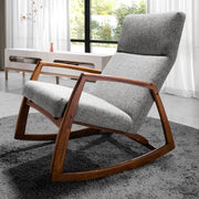 Kortárs stílusú, szürke színű szövettel kárpitozott hintaszék.