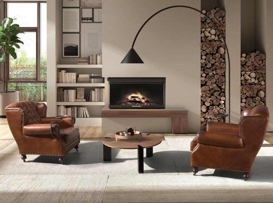 Chesterfield bőrfotelek kandallós nappali enteriőrben