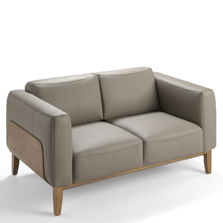 Kortárs, taupe színű bőrrel kárpitozott, diófa furnérral borított, dizájn kanapé.
