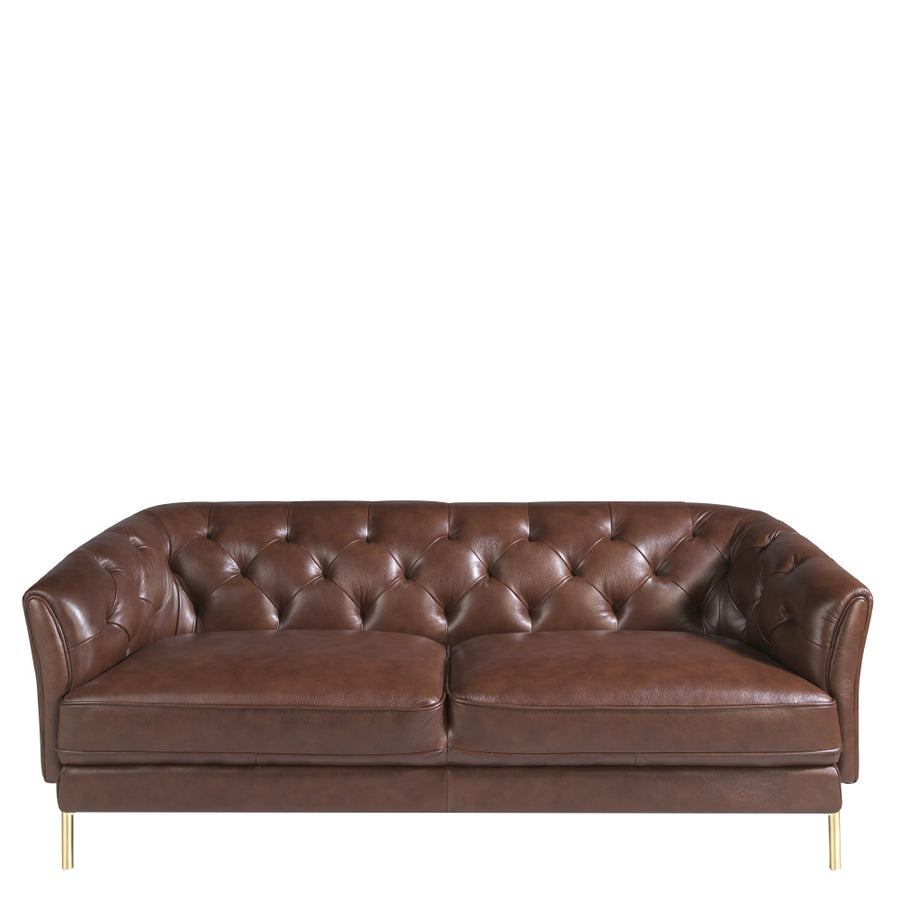 Kortárs stílusú, konyakszínű bőrrel kárpitozott, dizájn kanapé aranyszínű lábakkal.