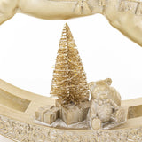 LED-es minifenyő, arany ajándékdobozok és mackó részletképe a Shiny hintaló dekoráció talpán.