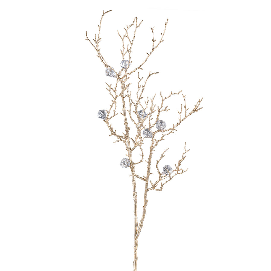 Aranyszínű mű dekorációs ág gyémántszerű díszekkel, fehér háttérrel.