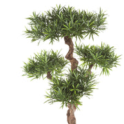 Élethű megjelenésű, mű kőtiszafa, fekete színű műanyag cserépben.