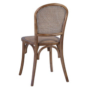 Koloniál stílusú, tölgyfából készült étkezőszék rattan ülőfelülettel és háttámlával.